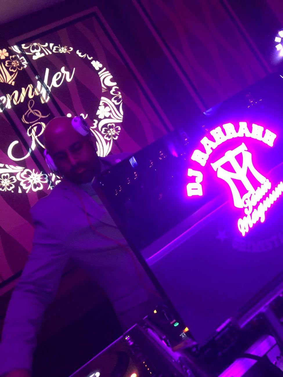 Custom monogram gobo and DJ RAH RAHH logo projected on the wall