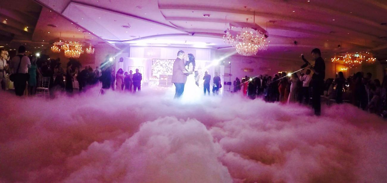 First dance on a cloud of low fog at a wedding reception