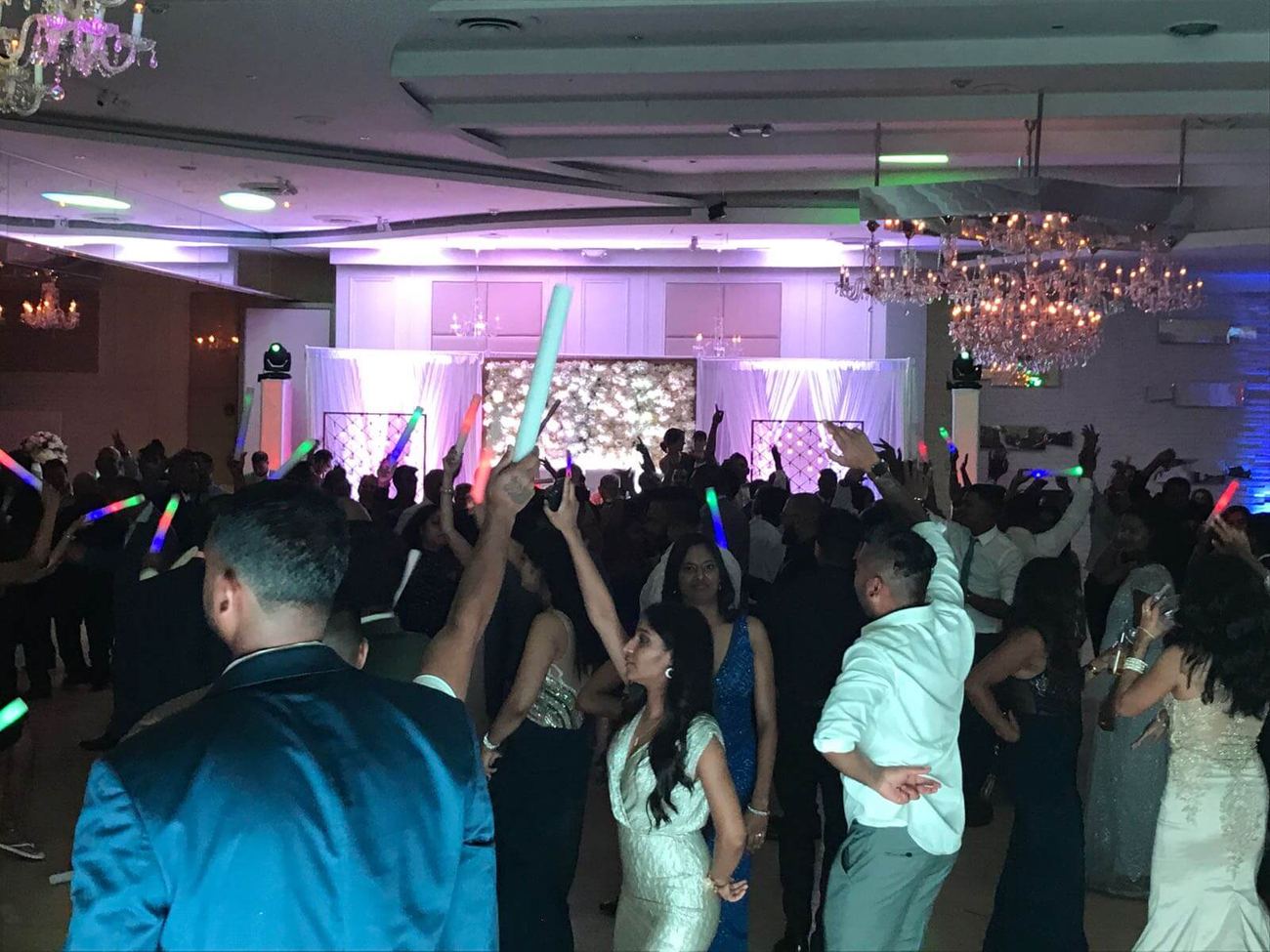 Guests dancing with glow sticks
